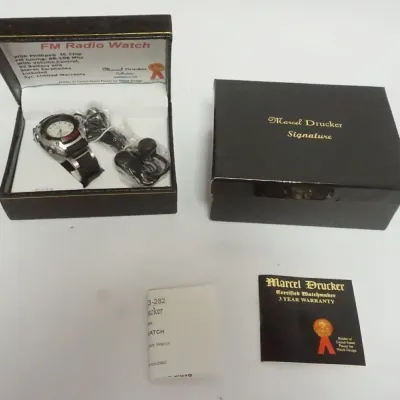Sale Photo Thumbnail #54: 1054	MARCEL DRUCKER SIGNATURE VINTAGE FM RADIO WRISTWATCH IN BOX, UNUSED																																																																																																																																																																																							