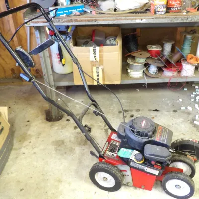Troy-Bilt walk-behind lawn edger and trencher powered by a 4.0 HP Briggs & Stratton engine, featuring a red and black metal frame...