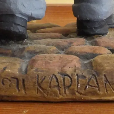 Detailed view of the base of a hand-painted figurine by Kaplan, dated 1971 and numbered 80 out of a limited edition of 500.