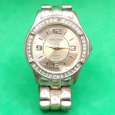 Waltham quartz wrist watch featuring a rhinestone-accented bezel and silver-tone link band.