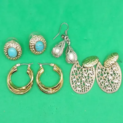 Collection of four pairs of costume earrings, including faux turquoise oval studs with gold-tone borders, silver-tone drop earrings with...