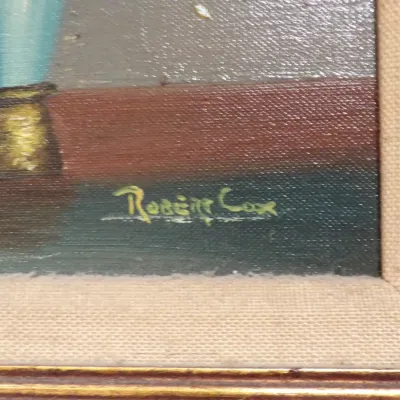 Close-up of an oil on canvas floral still life painting featuring a lower-right signature by artist Robert Cox, framed in a canvas mat...