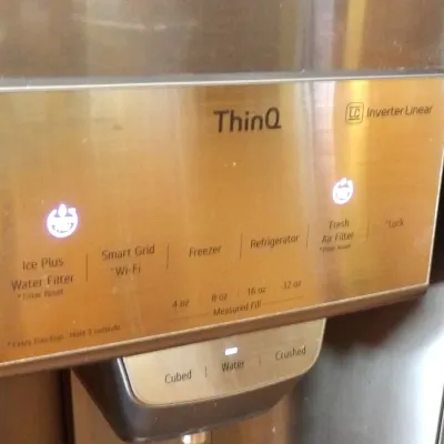 LG ThinQ refrigerator water and ice dispenser panel featuring illuminated digital controls and Inverter Linear technology.