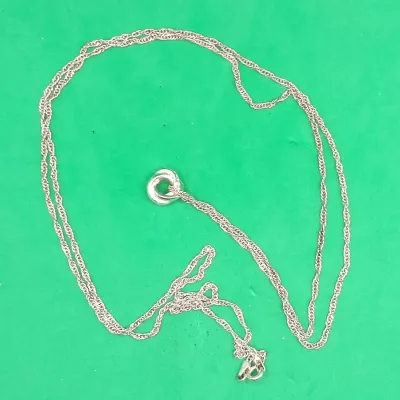 Delicate chain necklace featuring a polished interlocked ring or knot pendant.