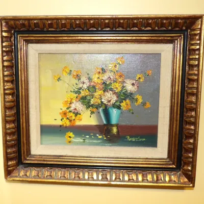Framed floral still life oil painting on canvas by Robert Cox, depicting yellow flowers in a vase, housed in an ornate carved gilt wood...
