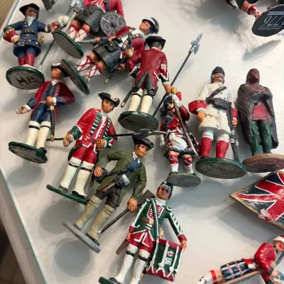 Sale Photo Thumbnail #175: Collection of vintage hand-painted miniature toy soldiers representing Revolutionary War and Scottish Highlander historical figures.