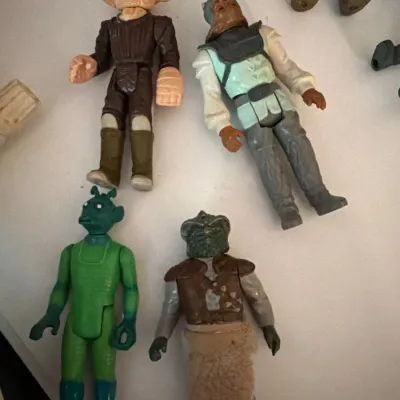 Group of vintage 1980s Kenner Star Wars action figures including Ree-Yees, Nikto, Greedo, and Squid Head.