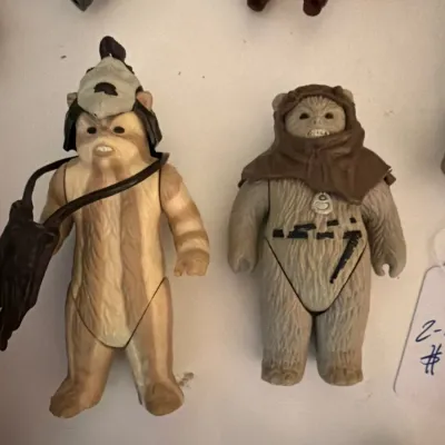 Pair of vintage Kenner Star Wars Ewok action figures from the 1980s, including Teebo with his headdress and satchel, and Logray, showing...