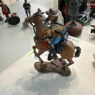 Sale Photo Thumbnail #133: Hand-painted military figurine depicting a cavalry soldier on horseback, mounted on a detailed base.