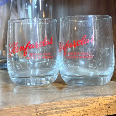 Sale Photo Thumbnail #228: Pair of Glenfarclas Single Malt Scotch Whisky lowball glasses with red printed branding.