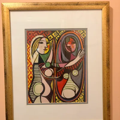 Framed art print of Pablo Picasso's 'Girl Before a Mirror', presented in a matted gilt wood frame.