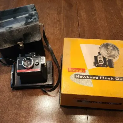 Hawkeye And Polaroid Cameras