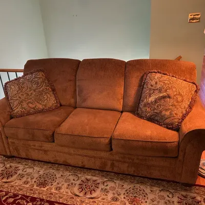 Brown Couch And Floor Lamp