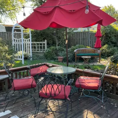 Metal Patio Chairs, Glass Top Table, And Umbrella 