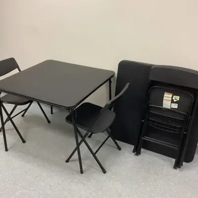 Two Folding Tables And Four Folding Chairs