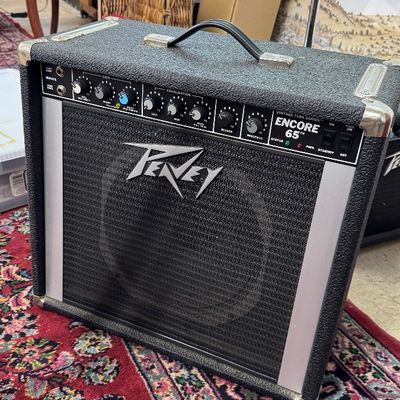Peavey Encore 65 Vintage Tube Series guitar amplifier combo, featuring a black textured casing with metal corner guards and original...