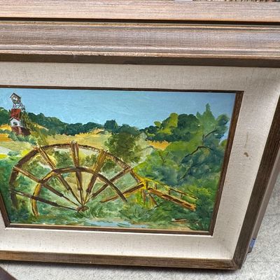 Framed original landscape painting featuring a water wheel and rural landscape, housed in a thick wood frame with a linen liner.