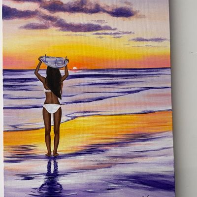 Original canvas painting of a woman in a white swimsuit carrying a surfboard at sunset on the beach, signed in the lower right corner.