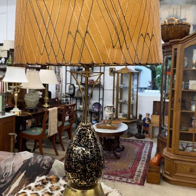 Sale Photo Thumbnail #12: Mid-century modern table lamp featuring a teardrop-shaped speckled ceramic base with brass accents and a tall, patterned drum shade.