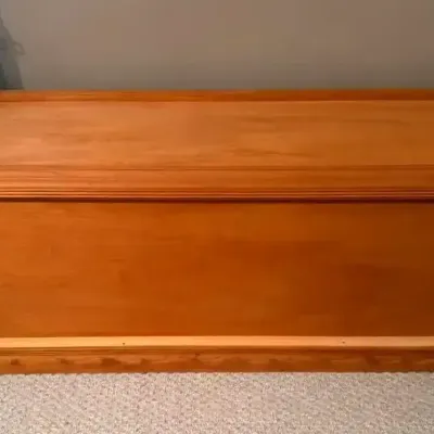 Light Wood Storage Chest With Paneled Design