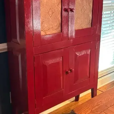 Red Wood Storage Cabinet with Decorative Punched Tin-Style Door Panels