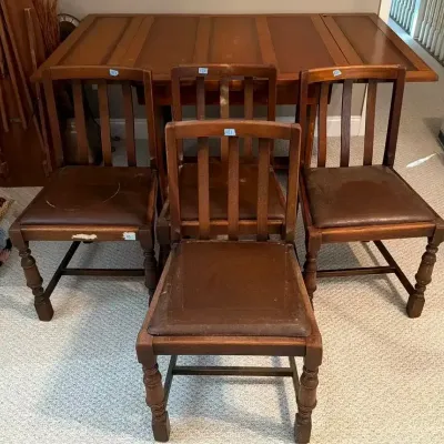 Wooden Dining Table with Four Slat-Back Chairs and Removable Leaves