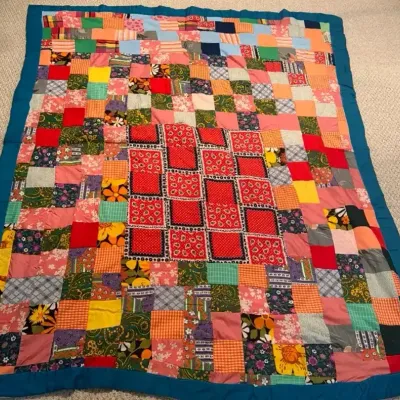 Multicolored Patchwork Quilt with Floral, Geometric & Teal Border