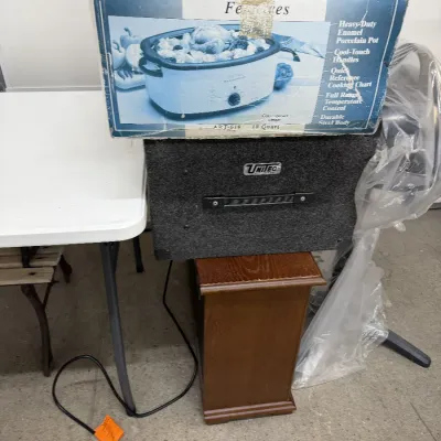 Vintage Aroma 18-quart electric roaster oven in its original box, displayed alongside a carpeted Unitec speaker cabinet and a...