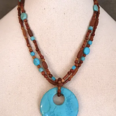 Wood Bead Necklace With Turquoise Colored Medallion