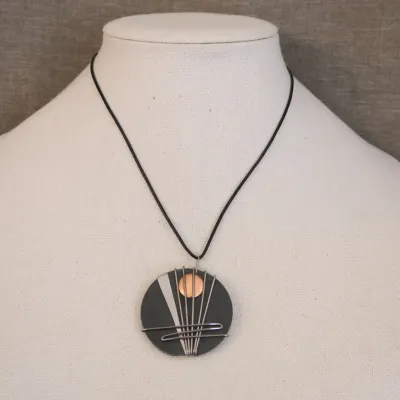 Artisan Necklace Pendant On Grey Slate
