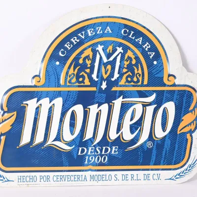 Sale Photo Thumbnail #137: Montejo Cerveza Embossed Metal Beer Sign