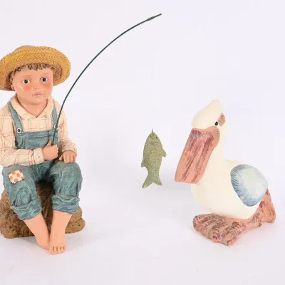 Sale Photo Thumbnail #147: Boy Fishing w/ Pelican Resin Figurines