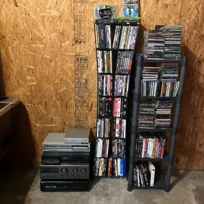 Sale Photo Thumbnail #247: Large Lot DVDs & CDs w/ Media Racks & Stereo