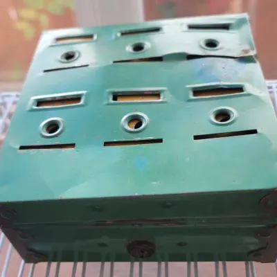 Sale Photo Thumbnail #48: Vintage green tin coin bank.