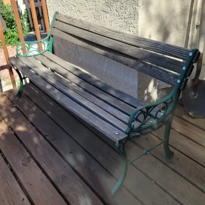Sale Photo Thumbnail #45: Outdoor garden bench with wooden slats.
