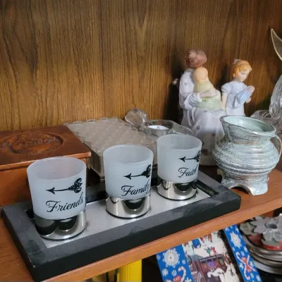 Sale Photo Thumbnail #12: Set of three frosted glass votive candle holders.