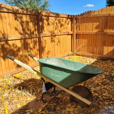 Sale Photo Thumbnail #2: Scotts green poly wheelbarrow.