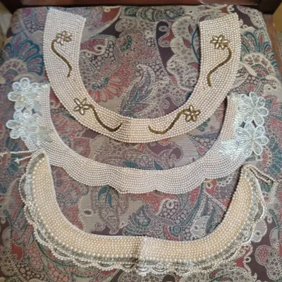 Sale Photo Thumbnail #50: Set of three vintage beaded faux pearl decorative dress collars featuring intricate floral beadwork and scalloped edges.