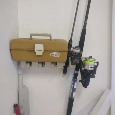 Two Fishing Rods And A Small Tackle Box