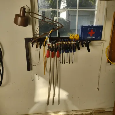 Clamps, First Aid Kit And Clamp Lamp.