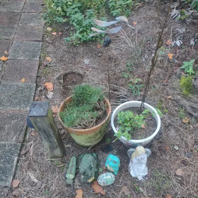 Two Clay Pots And Lawn Decor