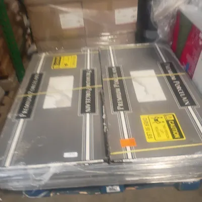 Sale Photo Thumbnail #11: Pallet of unopened boxes containing premium porcelain tiles, shrink-wrapped and heavy-duty strapped for transport.
