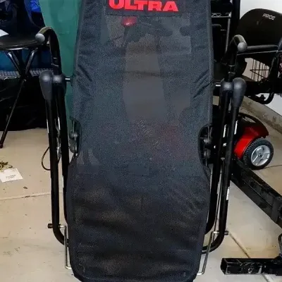 Core Lounge Ultra abdominal workout chair featuring a black mesh seat and sturdy metal frame, appearing in good condition.