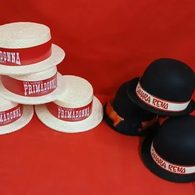 Collection of vintage Reno casino promotional hats, including white plastic boater hats for Del Webb's Primadonna Casino and black...
