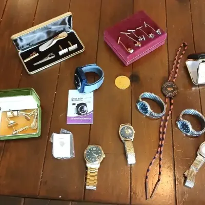 Collection of men's accessories including wristwatches, boxed cufflink and tie bar sets, collar pins, a bolo tie, and a small...