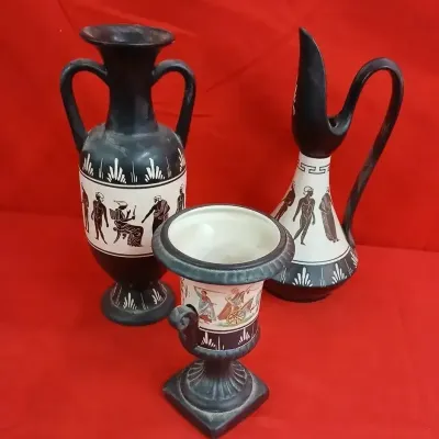 Trio of vintage Greek-revival black terracotta pottery pieces featuring classic black-figure and polychrome classical figure motifs,...