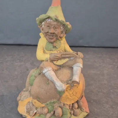 Sale Photo Thumbnail #12: Vintage Cairn Studio Tom Clark gnome figurine, featuring a whimsical seated character with a pointed hat on a textured base.