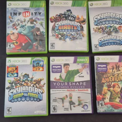 Sale Photo Thumbnail #11: Collection of six Xbox 360 video games, including Disney Infinity, various Skylanders titles, and Kinect games.