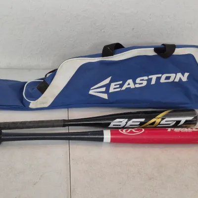 Sale Photo Thumbnail #56: Blue and white Easton equipment bag alongside an Easton Beast youth baseball bat and a red and black Rawlings T-ball bat.