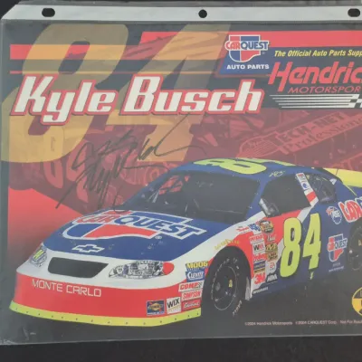 Sale Photo Thumbnail #46: Autographed 2004 Kyle Busch #84 Carquest Hendrick Motorsports hero card, encased in a protective plastic sleeve with COA